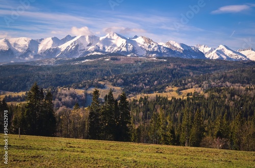 Charming panorama of the Polish Tatra Mountains in the morning. View of the High Tatras from the village of Lapszanka, Poland.