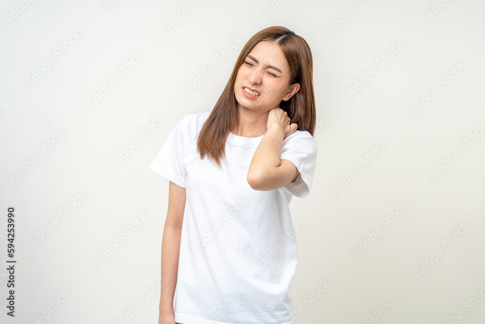 Asian woman has problem with structural posture She had neck and shoulder pain. She massaged her neck and shoulders for relief. reduce muscle tension. Standing on isolated white background Asian woman has problem with structural posture She had neck and shoulder pain. She massaged her neck and shoulders for relief. reduce muscle tension. Standing on isolated white background
