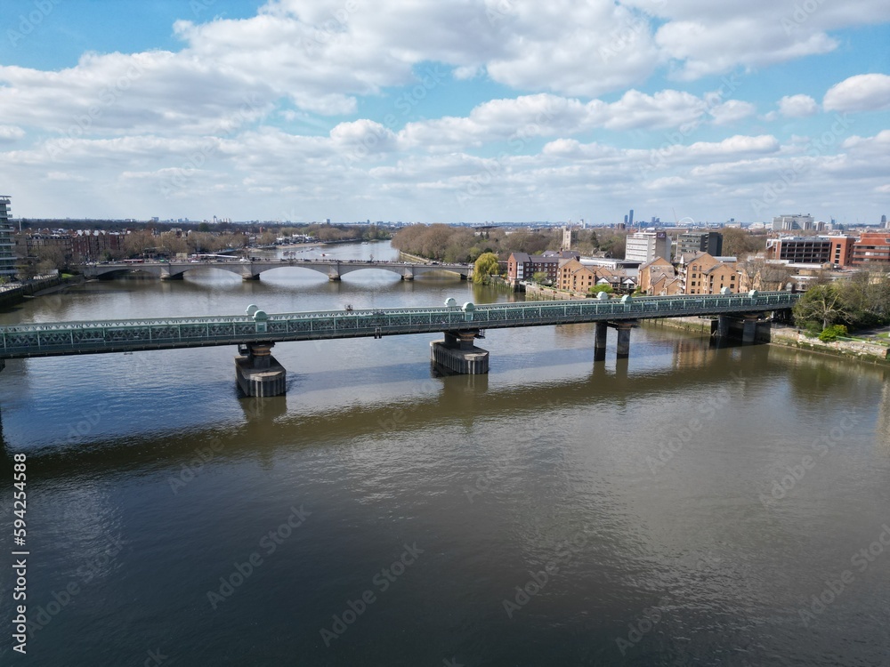 Fototapeta premium Fulham railway bridge over river Thames London UK drone aerial,.