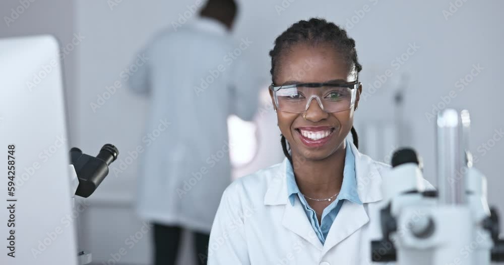 Black woman, scientist and face, happy with science study in laboratory, safety goggles and medical research. Portrait, female doctor smile with experiment and scientific innovation in biotechnology