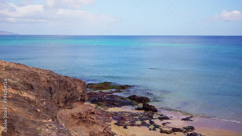 Rocky shore, beautiful sea and swimming diver. Rocky shore, beautiful sea and swimming diver.