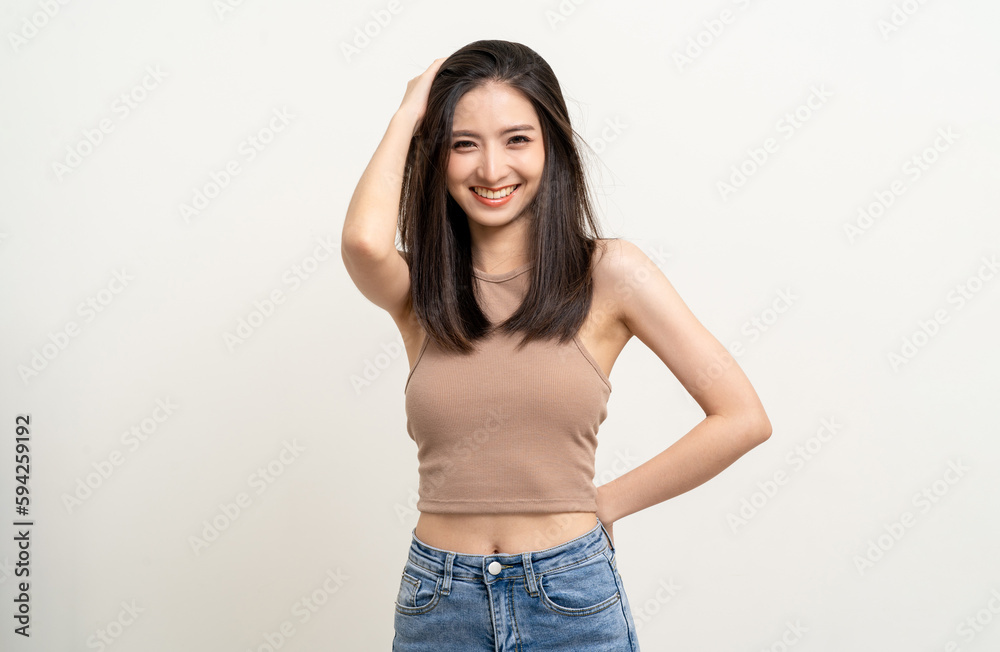 Beautiful smiling happy young asian woman age around 25 in brown shirt. Charming female lady standing pose on isolated white background. Asian cute people looking camera confident with white backdrop. Beautiful smiling happy young asian woman age around 25 in brown shirt. Charming female lady standing pose on isolated white background. Asian cute people looking camera confident with white backdrop.