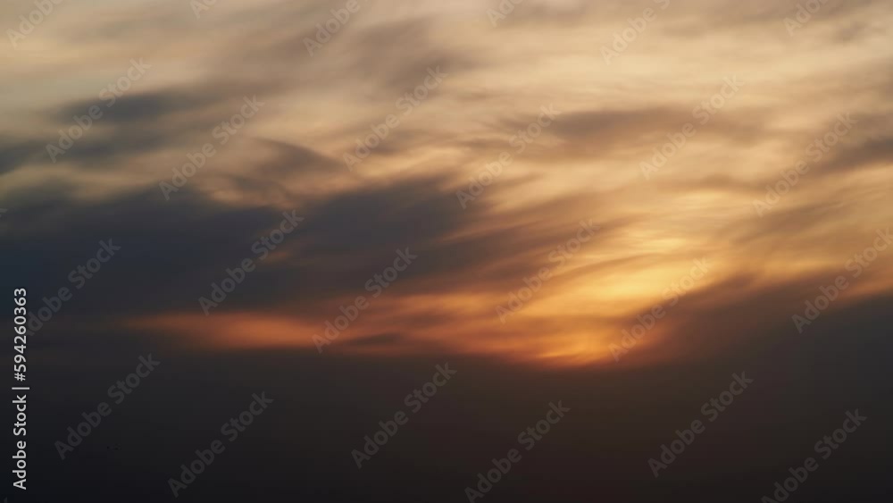 Sunset sky with red light of the setting sun, timelapse. Evening clouds in the orange light of sunset rays, time lapse Sunset sky with red light of the setting sun, timelapse. Evening clouds in the orange light of sunset rays, time lapse