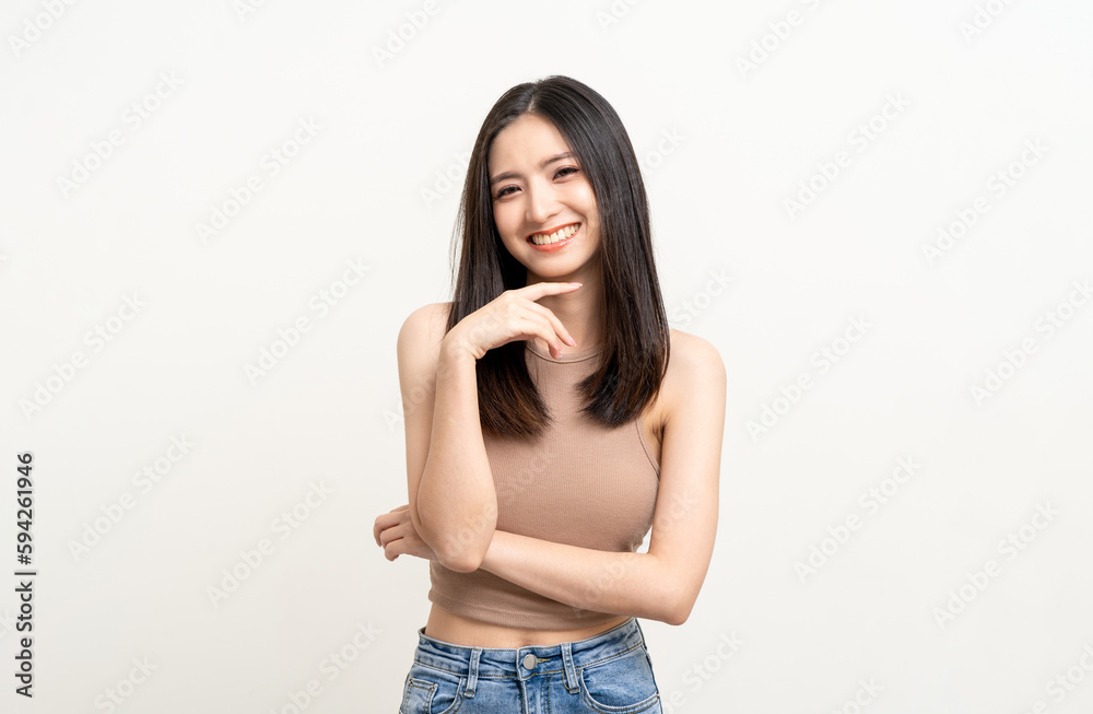 Beautiful smiling happy young asian woman age around 25 in brown shirt. Charming female lady standing pose on isolated white background. Asian cute people looking camera confident with white backdrop. Beautiful smiling happy young asian woman age around 25 in brown shirt. Charming female lady standing pose on isolated white background. Asian cute people looking camera confident with white backdrop.