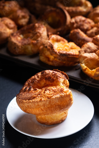 Food Concept Homemade spot focus Yorkshire pudding on black background with copy space
