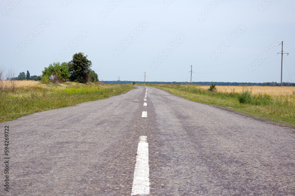 Fototapeta premium Old motor road in the countryside in summer