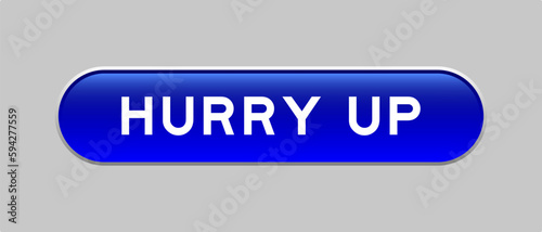 Blue color capsule shape button with word hurry up on gray background