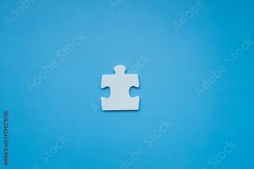 Top view Puzzle pieces on blue background, Jigsaw puzzle with missing piece, Missing jigsaw puzzle pieces and business concept.