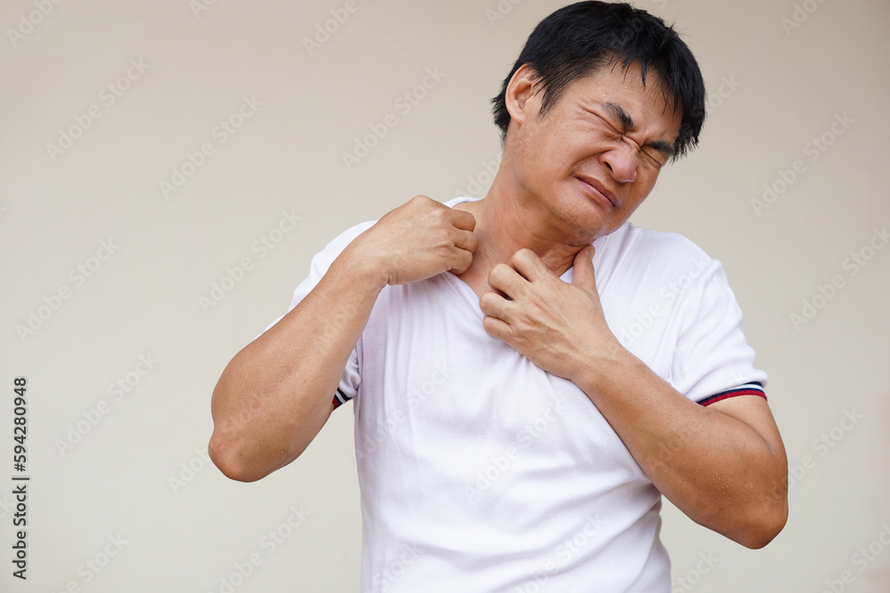 Asian man feels hot, uncomfortable, unhappy with hot weather sweltering condition that can cause heatstroke, sick or illness. Concept, global warming effect with health Asian man feels hot, uncomfortable, unhappy with hot weather sweltering condition that can cause heatstroke, sick or illness. Concept, global warming effect with health