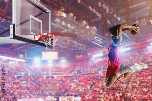 Basketball player jumping to make a basket during a match