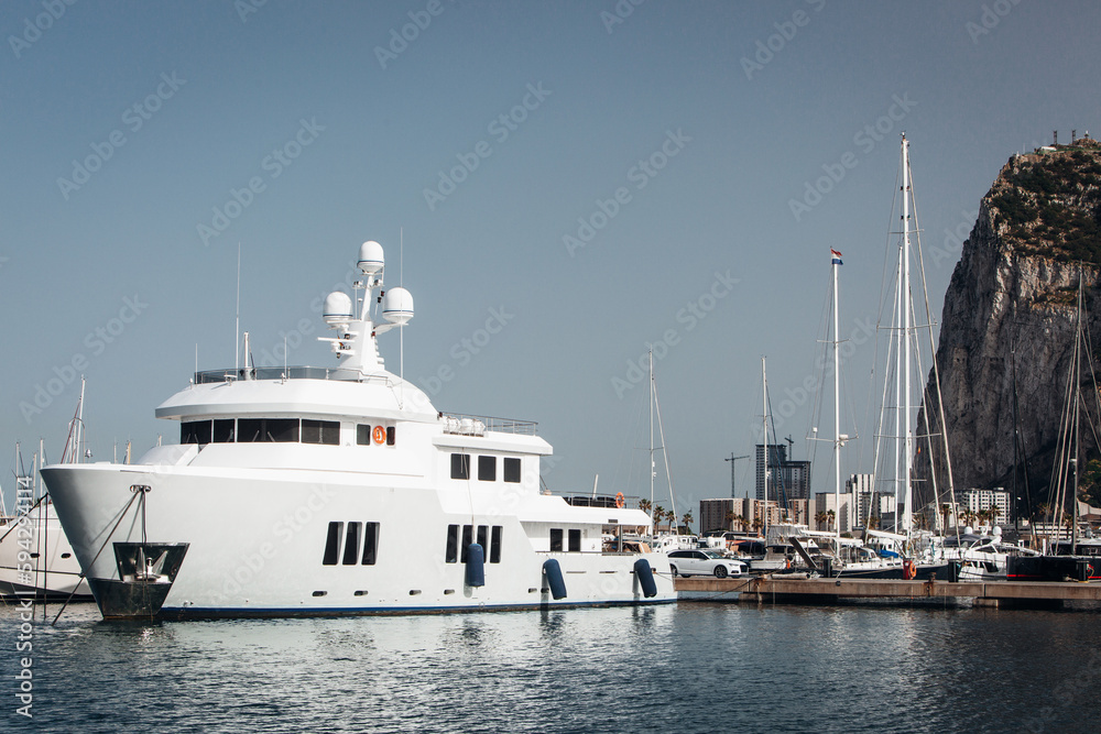 Modern motor boats and yachts docked in sea port Modern motor boats and yachts docked in sea port