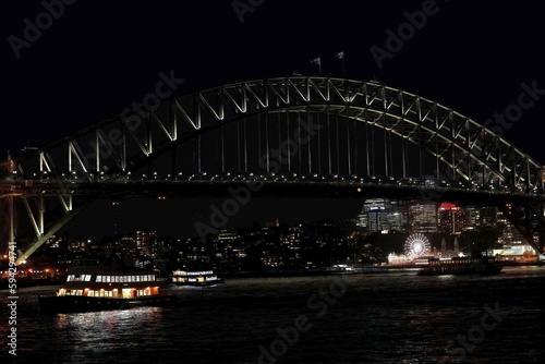 Sydney Harbour Bridge-arch and pylons-viewed from the Opera House at night under floodlight. NSW-Australia-589