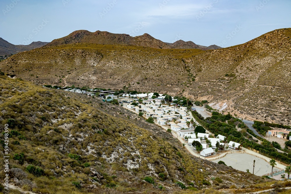 Scenic hilly valley with small town, rural landscape Scenic hilly valley with small town, rural landscape
