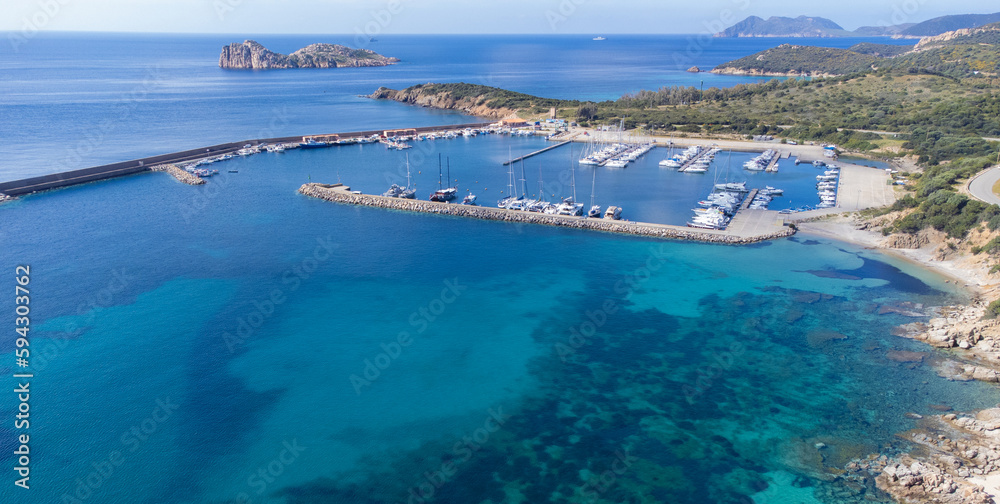 Port of teulada and aerial view of porto tramatzu beach in south sardinia
