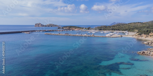 Port of teulada and aerial view of porto tramatzu beach in south sardinia 