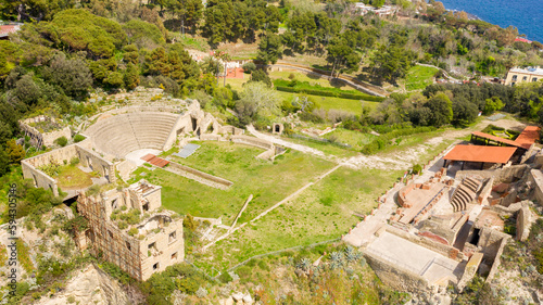 Aerial view of the Odeon and the Roman theater of the imperial villa in the archaeological park of Pausilypon. The ancient Roman ruins are located in the Posillipo district, in Naples, Campania, Italy photo