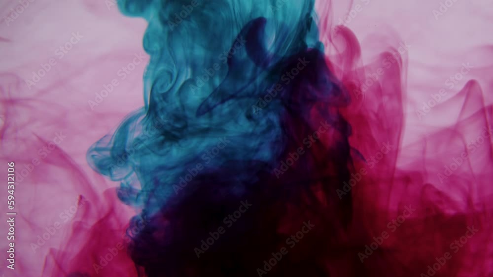 Colorful ink in a white water background slow motion