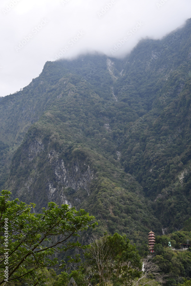 Vertical, beautiful view of hills on a cloudy day in Tianxiang, Xiulin, Hualien, Taiwan
