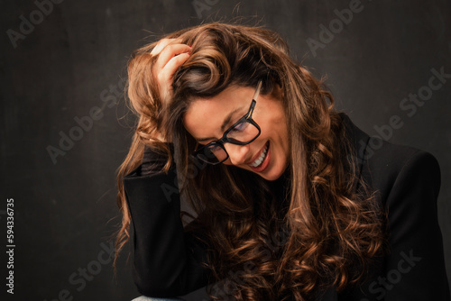 Beautiful brunette haired woman with eyewear studio portrait against at isolated background