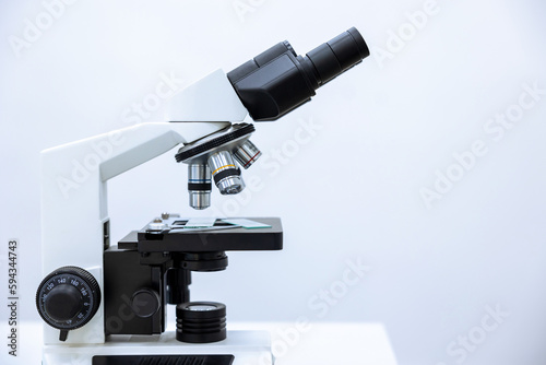 Image of microscope, chemistry, pharmaceutical instrument, microbiology magnifying tool. Copy space.