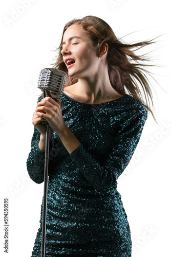 Beautiful young female singer with vintage microphone photo