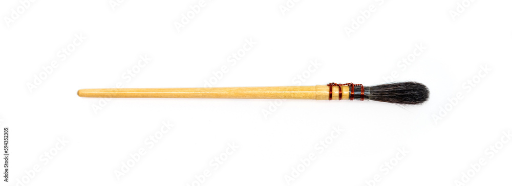 Watercolor paint brushes on white background. Pointed brushes. Close up. Watercolor paint brushes on white background. Pointed brushes. Close up.