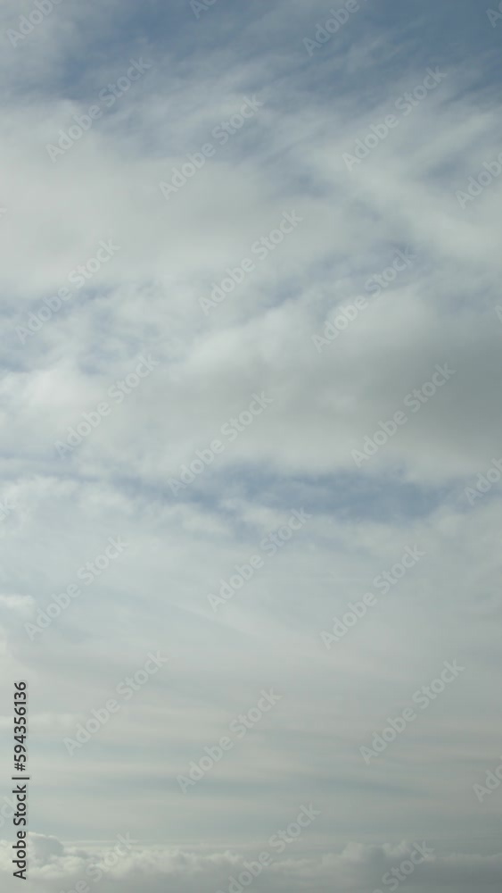 Rapid cloud movement in the sky as a video backdrop, time-lapse, speed-up footage. Vertical video. Rapid cloud movement in the sky as a video backdrop, time-lapse, speed-up footage. Vertical video.