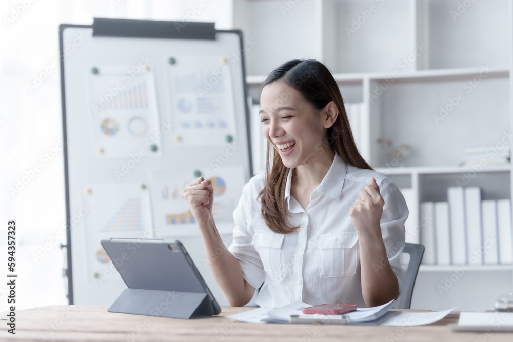 Confident Asian businesswoman calculating finances in the accounting and balance sheet work of the stock market and international exchange rates, Authorized Share Capital, Owners Equity, Common Stock Confident Asian businesswoman calculating finances in the accounting and balance sheet work of the stock market and international exchange rates, Authorized Share Capital, Owners Equity, Common Stock