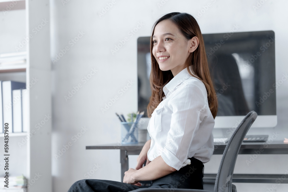 Confident Asian businesswoman calculating finances in the accounting and balance sheet work of the stock market and international exchange rates, Authorized Share Capital, Owners Equity, Common Stock Confident Asian businesswoman calculating finances in the accounting and balance sheet work of the stock market and international exchange rates, Authorized Share Capital, Owners Equity, Common Stock