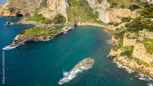 Aerial view on the Trentaremi bay of Posillipo, a district of Naples, Italy. There is a small empty beach in a cove. The coast overlooks the Mediterranean Sea. photo