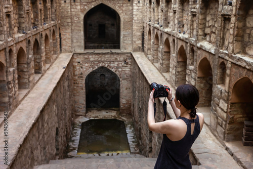 Photography Tourist photographing a stepwell Agrasen ki Baoli .Delhi, India