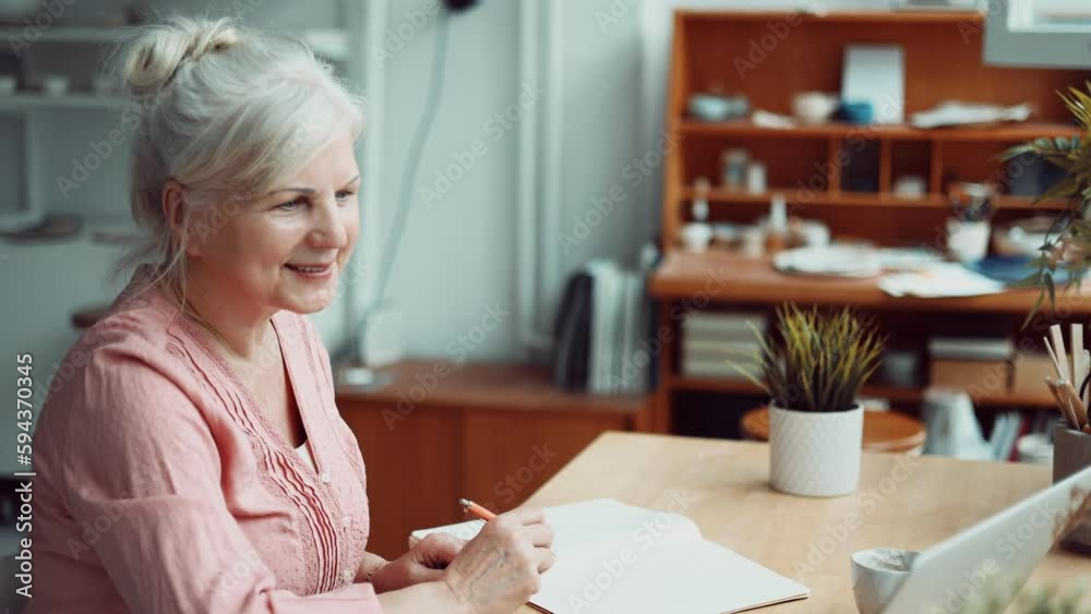 Senior woman using laptop at home
Senior woman using laptop at home
