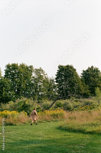 Woman walking into field
