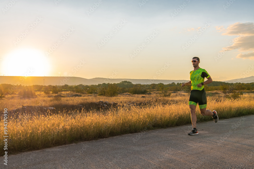 Triathlete in professional gear running early in the morning, preparing for a marathon, dedication to sport and readiness to take on the challenges of a marathon. 