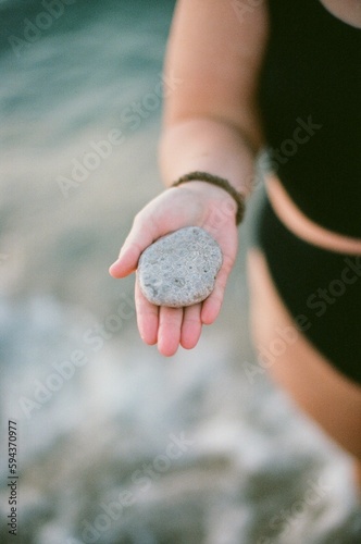 Person holding a Petoskey stone photo