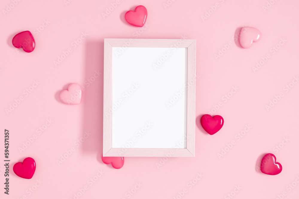Valentine's day concept. Photo frame, pink hearts on pastel pink background. Love concept. Saint Valentine. Flat lay, top view, copy space Valentine's day concept. Photo frame, pink hearts on pastel pink background. Love concept. Saint Valentine. Flat lay, top view, copy space