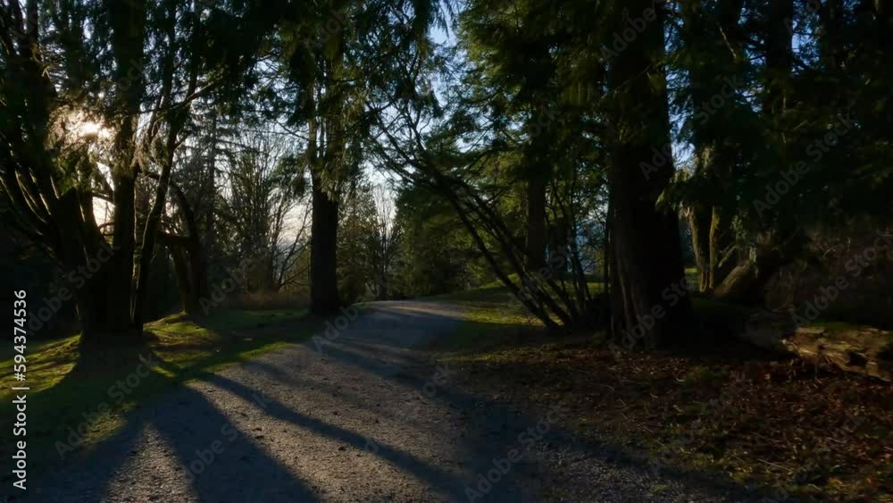 Hiking Trail on top of Burnaby Mountain during Sunny Spring Season Sunset. Vancouver, British Columbia, Canada. Hiking Trail on top of Burnaby Mountain during Sunny Spring Season Sunset. Vancouver, British Columbia, Canada.