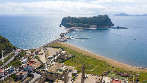 Aerial view of the island of Nisida. It is located in Naples, Italy. Nisida is a volcanic islet of the Flegrean Islands archipelago. It is connected to the city by a long pier. photo