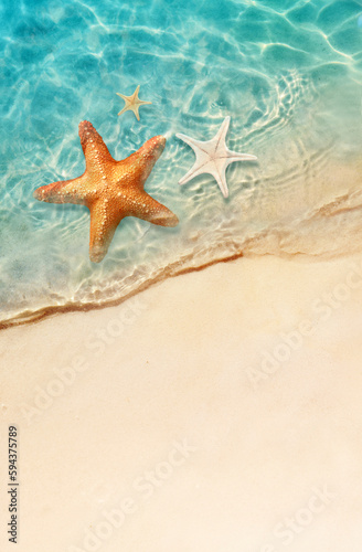 Starfish on the sand beach in clear sea water. Summer background. Summer time .Copy space. Relaxing on the beach.