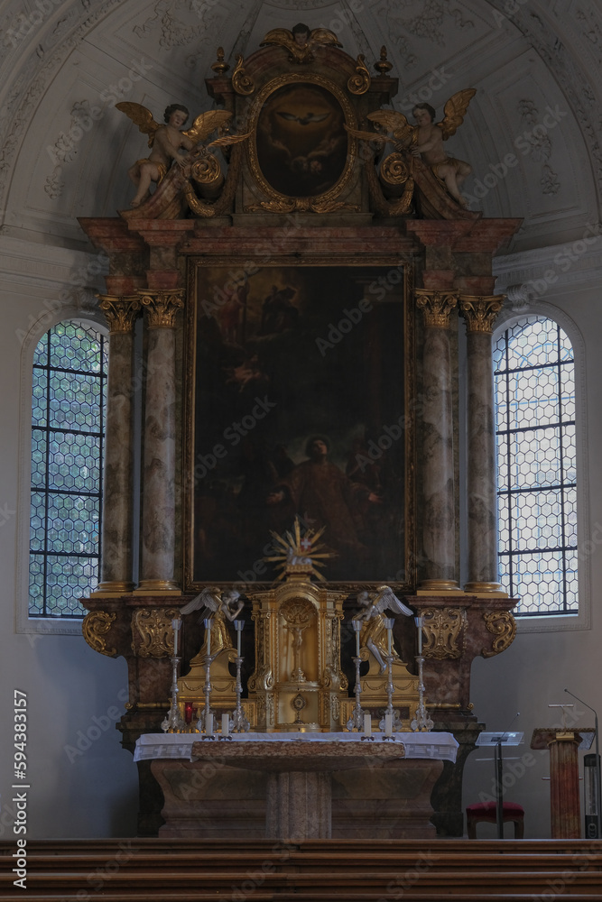 Magnificent opulent splendid Bavarian baroque church basilica interiors with stucco, murals, altar, Pilars, ceiling paintings, gold, wood domes nave	