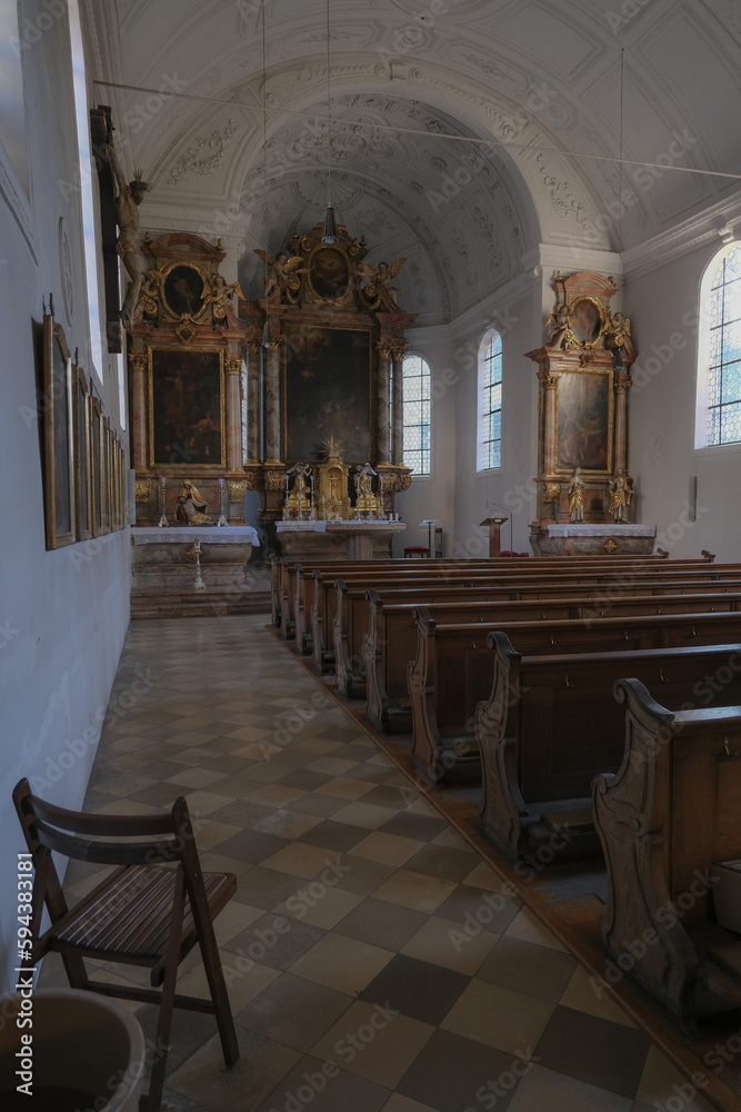 Magnificent opulent splendid Bavarian baroque church basilica interiors with stucco, murals, altar, Pilars, ceiling paintings, gold, wood domes nave	