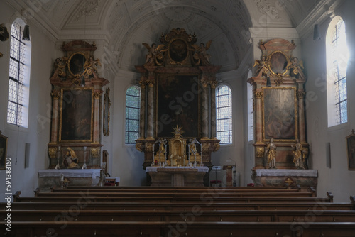 Magnificent opulent splendid Bavarian baroque church basilica interiors with stucco, murals, altar, Pilars, ceiling paintings, gold, wood domes nave 