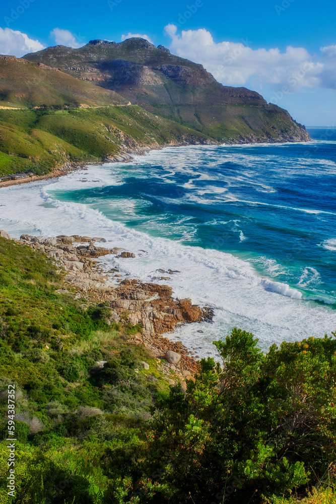 A photo of mountains, coast and ocean from Shapmanns Peak,. A photo mountains, coast and ocean from Shapmanns Peak, with Hout Bay in the background. Close to Cape Town.