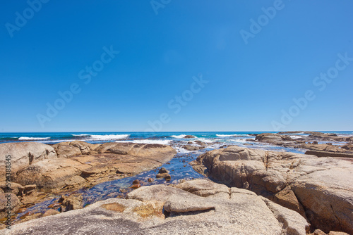 Rocky coastline of the Camps Bay, Western Cape. Ocean view - Camps Bay, Table Mountain National Park, Cape Town, South Africa.