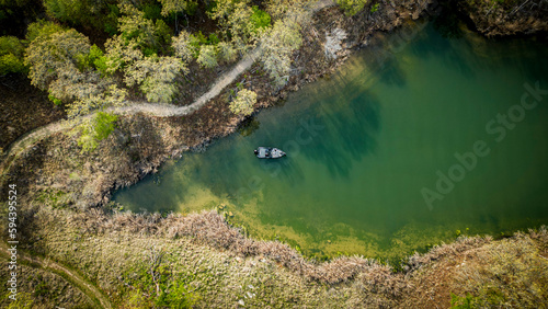Fisherman fishing in shallow clear water 