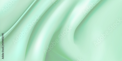 Background of light green fabric with several folds