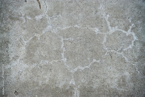 Graue raue alte Steinfelsfläche mit weißem Muster als Hintergrund photo