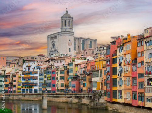Girona cathedral and houses along Onyar river at sunset, Spain
