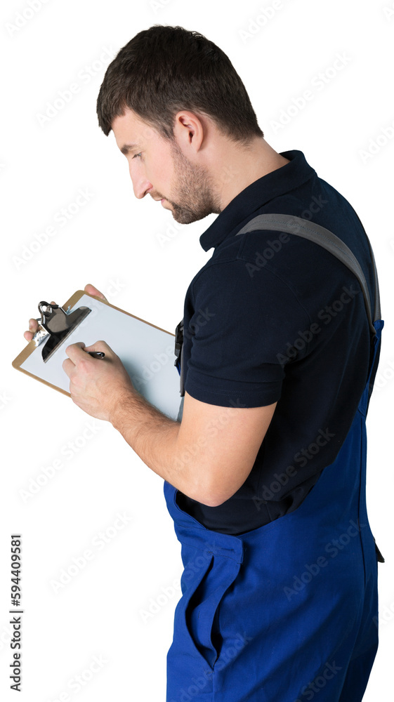Mechanic Examining while Writing on Clipboard Mechanic Examining while Writing on Clipboard