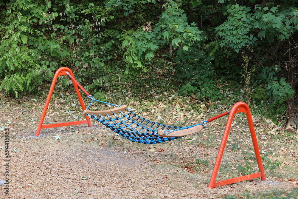 Separate standing net swings in the playground green swings in the wood in the forest open air activities healthy childhood Separate standing net swings in the playground green swings in the wood in the forest open air activities healthy childhood